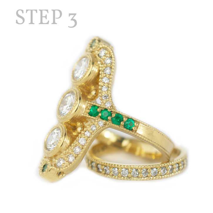 Left side profile and details of the Jacqueline, 18k yellow gold, three 0.5 carat center diamonds, 0.31 ctw accent emeralds custom made by Abby Sparks Jewelry, step 3.