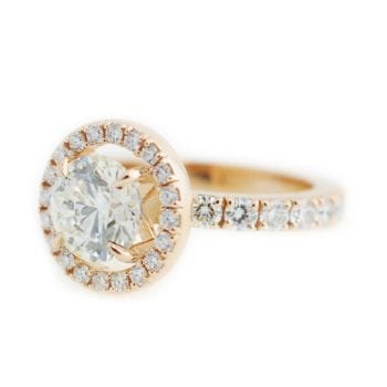 Left angle profile and details of the The Kathryn, an engagement ring made of 14k rose gold, 1.74 carat diamond, and 1.38 ctw diamonds custom made and designed by Abby Sparks Jewelry.