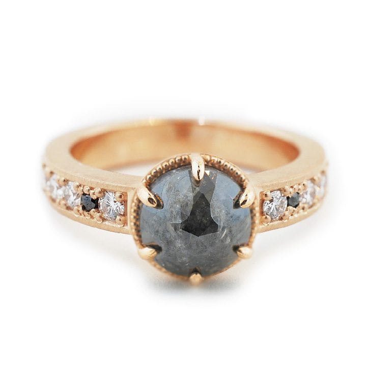 Custom engagement ring made with 14k rose gold, 1.9 carat rough diamond, 0.29 ctw diamonds, and 0.002 ctw black diamond melee custom made and designed by Abby Sparks Jewelry, The Nicole.