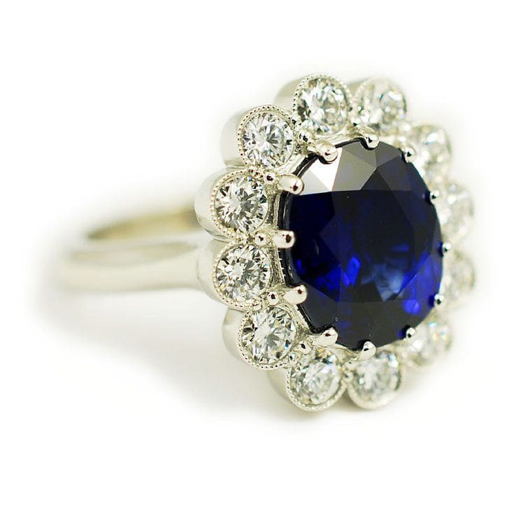 Right side profile and details of the The Morgan, an engagement ring made of platinum, 5.57 carat sapphire, and 1.28 ctw diamonds custom made by Abby Sparks Jewelry.