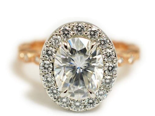 PLATINUM AND ROSE GOLD OVAL HALO ENGAGEMENT RING