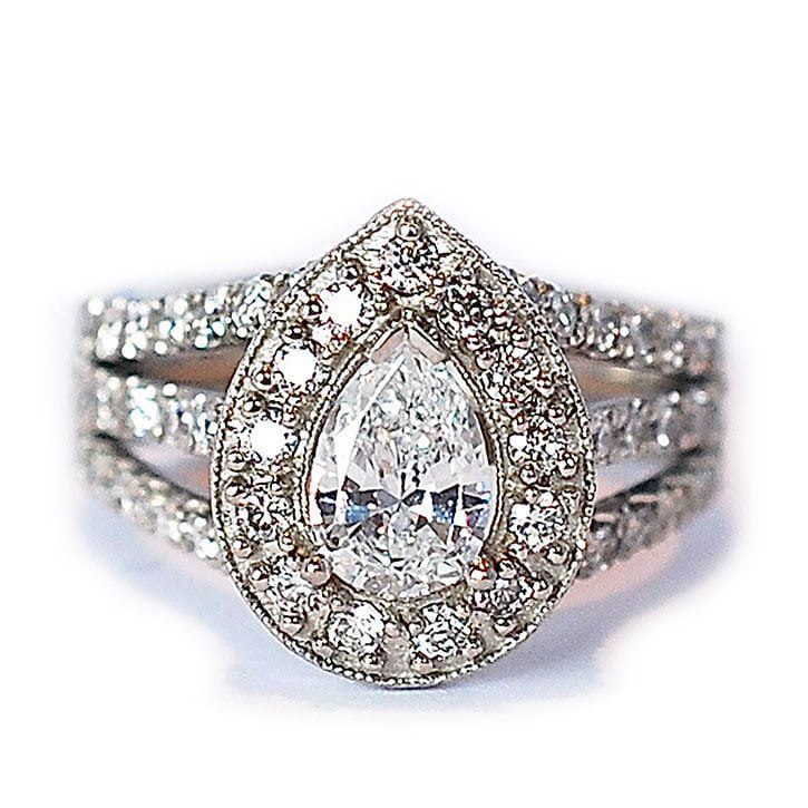 Custom engagement ring made with 18k white gold, 1.0 carat pear cut diamond, and 1.65 ctw diamond accents made and designed by Abby Sparks Jewelry, The Erika.