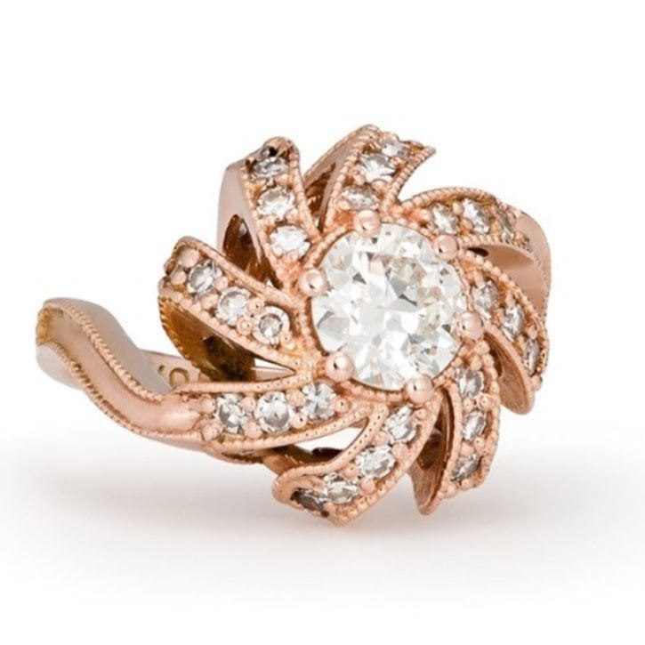 Nature inspired engagement ring made with 14k rose gold, 0.90 carat round diamond, and 1.03 ctw diamond melee custom made and designed by Abby Sparks Jewelry, The Amber.