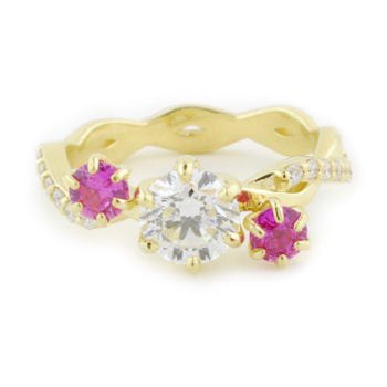 Custom engagement ring made with 18k yellow gold, 1.09 carat diamond, 0.6 ctw pink sapphire, and 0.21 ctw diamond melee custom made and designed by Abby Sparks Jewelry, The Tess.