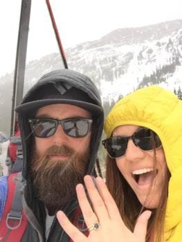 Mike and Clara ski life Colorado proposal with 14k yellow gold and 1.4 carat sapphire custom engagement ring made by Abby Sparks Jewelry.