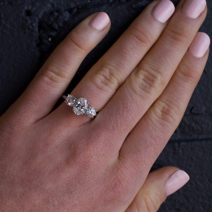 three stone oval halo engagement rings